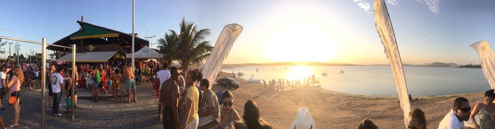 People at beach against sky