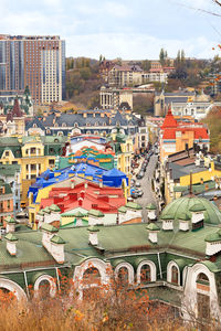 High angle view of houses against sky in city