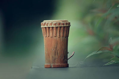 Close-up of drink in container on table