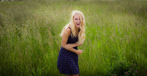 Portrait of young woman in field