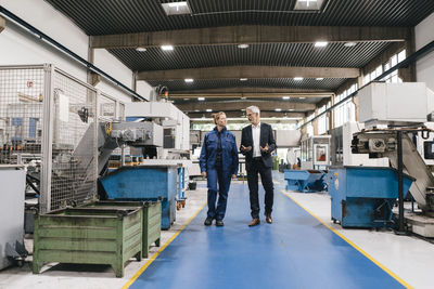 Manager and skilled worker of a high tech enterprise having a meeting