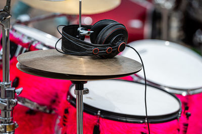 A set of plates in a drum set. at a concert of percussion music, selective focus, close-up