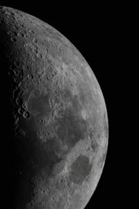 Low angle view of moon against sky at night