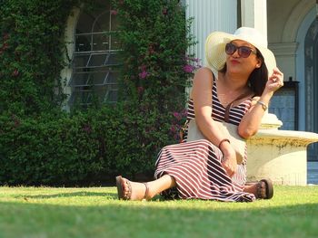 Portrait of woman sitting in swimming pool