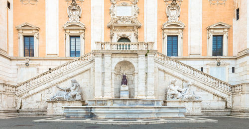 Statue in front of historical building