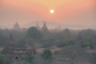 Panoramic view of temple against sky during sunset