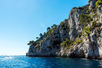 Scenic view of sea against clear blue sky