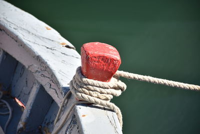 Close-up of rope tied to bollard