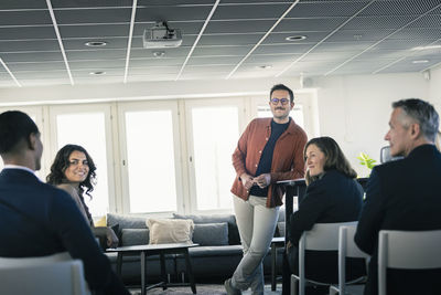 Group of business people attending presentation during conference