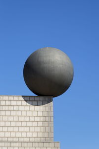 Low angle view of built structure against clear blue sky