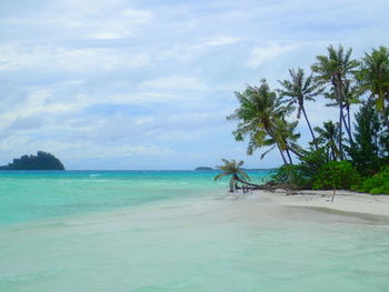 Scenic view of sea against cloudy sky