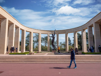 Full length of woman walking against sky