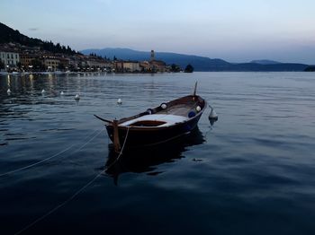 Lone boat moored in calm lake