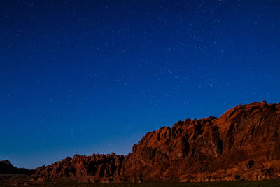 Low angle view of mountain against sky at night