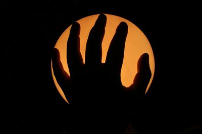 Close-up of illuminated pumpkin against black background