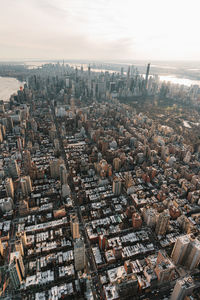 High angle view of modern buildings in city against sky