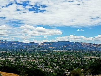 Scenic view of landscape against cloudy sky