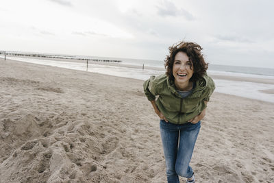 Portrait of happy woman on the beach