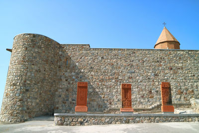 Exterior of historic building against clear blue sky