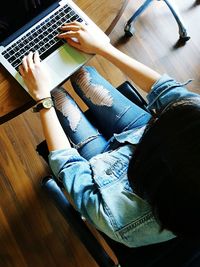 High angle view of man using laptop