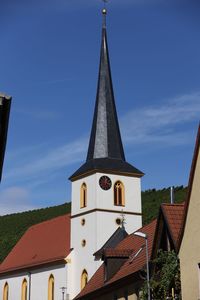 Low angle view of building against blue sky