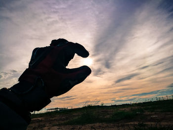 Low angle view of silhouette statue against sky