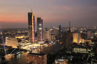 High angle view of illuminated buildings in city against sky