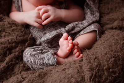 Low section of baby feet