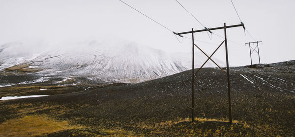 Scenic view of mountains against sky during winter