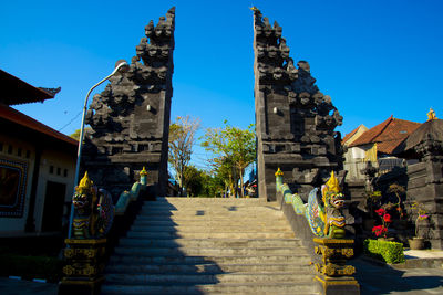 Staircase of building against blue sky