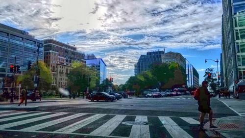 People walking on road in city