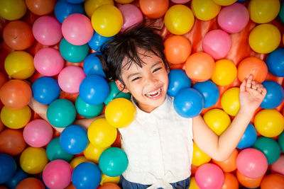 High angle portrait of woman with balloons