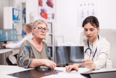 Female doctor working in office