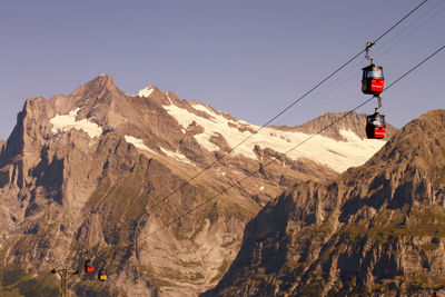 Scenic view of snowcapped mountains against clear sky