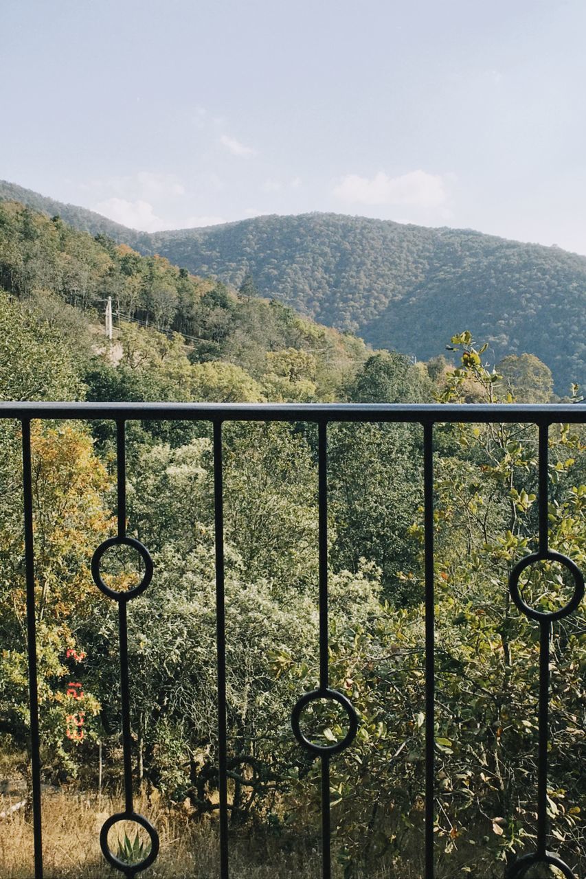 mountain, nature, security, railing, metal, day, sky, no people, protection, gate, fence, scenics - nature, mountain range, plant, outdoors, beauty in nature, wrought iron, tree, tranquility, landscape, architecture, environment, tranquil scene, land, sunlight, closed, cloud