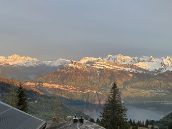 Scenic view of snowcapped mountains against sky