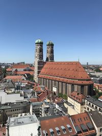 High angle view of buildings against blue sky