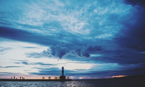 Scenic view of sea against cloudy sky