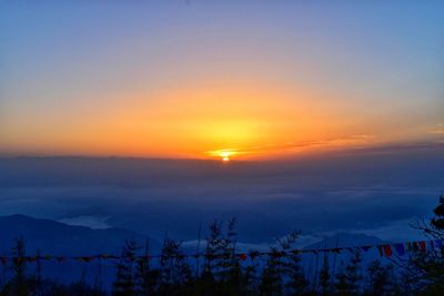 Scenic view of silhouette landscape against sky during sunset