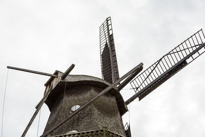 Low angle view of windmill  against sky