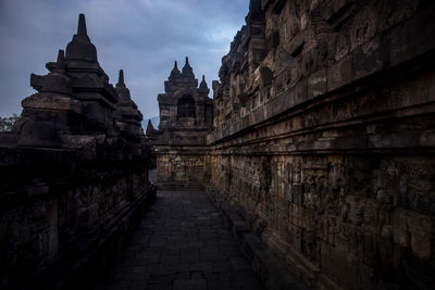 View of temple against buildings