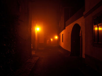 Empty illuminated street lights at night