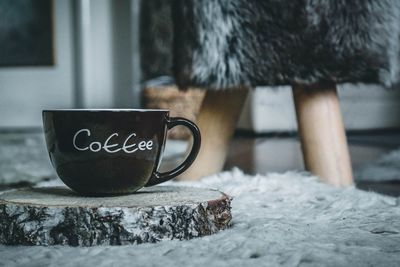 Close-up of coffee cup on table