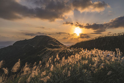 Scenic view of mountains against sky during sunset