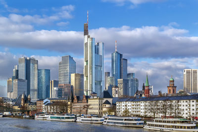 Modern buildings in city against sky