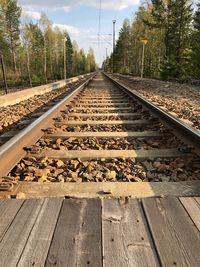 High angle view of railroad tracks against trees