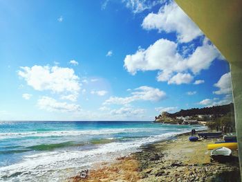 Scenic view of beach against blue sky