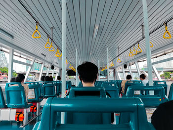 Rear view of people sitting in bus