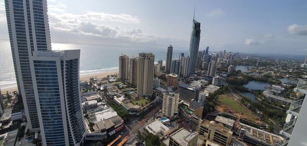 High angle view of modern buildings in city against sky