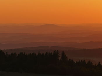 Scenic view of silhouette trees against sky during sunset
